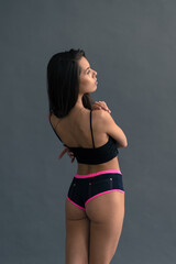 Young and beautiful dancer posing in studio
