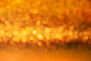 Yellow and orange color abstract bacground withe blurred defocus bokeh light for template.