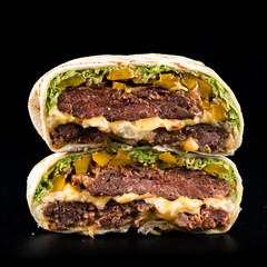 Grilled beef burgers in pita bread with cheese and arugula leaves