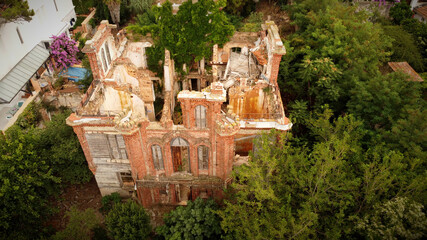 in and outside a destroyed red brick villa on Prinkipo Island, Büyükada in the Sea of Marmara...