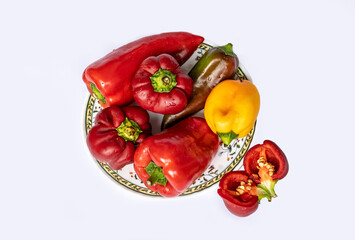 Bell pepper on a plate. The background is white, there is free space for insertion.