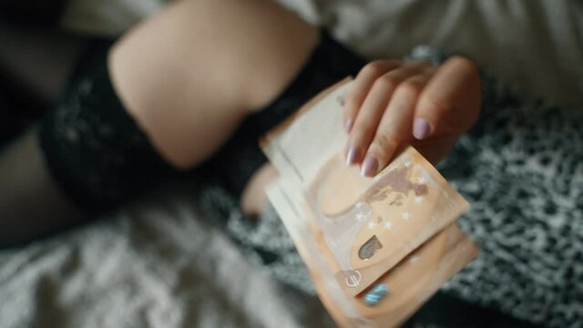 Man gives a woman money for a time well spent.