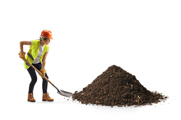 Female construction worker digging with a shovel