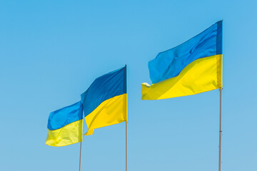 National flag of Ukraine, a symbol of patriotism and the nation of Ukraine against the blue sky