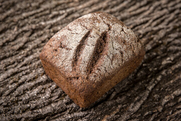 Crusty Fresh Homemade Olive and Rosemary rye bread on Rustic Background