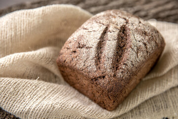 Crusty Fresh Homemade Olive and Rosemary rye bread on Rustic Background
