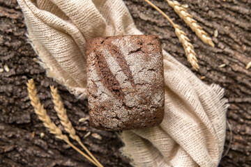 Crusty Fresh Homemade Olive and Rosemary rye bread on Rustic Background
