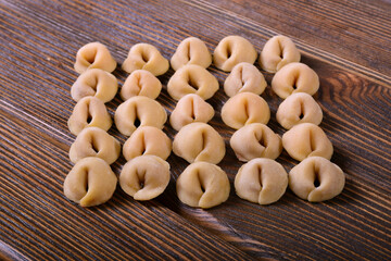 Raw dumplings on the table. Handmade