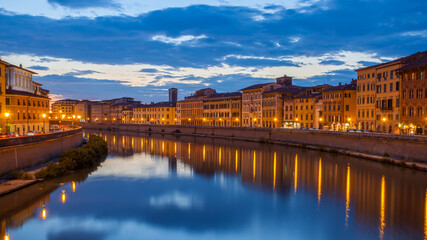 Fototapeta na wymiar City of Pisa and Arno river at dusk