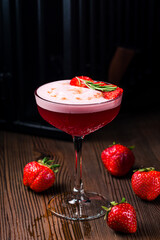 Red alcoholic Strawberry cocktail with ice cubes
