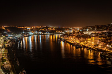 Fototapeta na wymiar Porto downtown and Douro River wallpaper by night