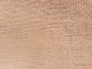 A plowed field with a path. Texture, background. Aerial photo