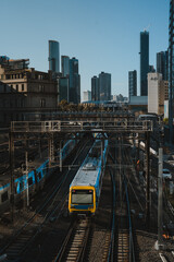 City Train Cutting Through Inner City High-Rise Buildings 