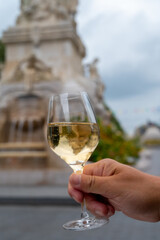 Drinking of brut champagne sparkling wine in street cafe in old central part of city Reims, Champagne, France