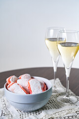 Symbols of Reims - glasses with brut champagne and rose biscuits