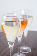 Tasting of white and rose champagne sparkling wine from flute glasses
