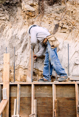 Building a wooden form for new concrete retaining wall