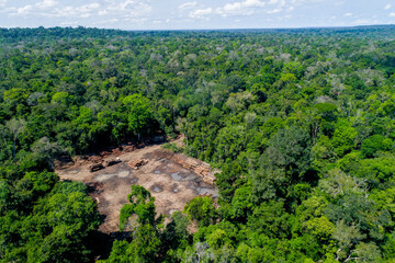 Fototapeta na wymiar Aerial view of a log storage yard from authorized logging in an area of the brazilian Amazon rainforest.