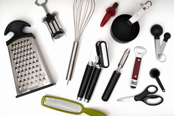 Photograph of a kitchen drawer filled with an assortment of kitchen utensils