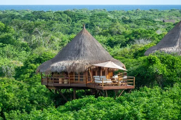 Foto op Canvas Aerial panoramic view of a bungalow nature village in the middle of the forest.  © Diego Gomez