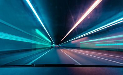 Drivers front view, driving fast in a tunnel by var with lots of blurry lights.