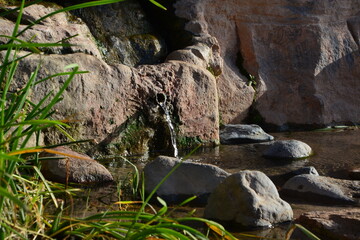 water flowing into the rocks
