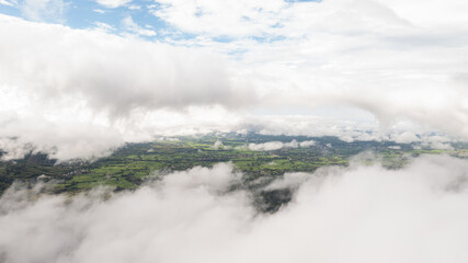 An aerial view of the forest amid the lush rain covering the tropical rainforest mountains during the rainy season in northern.Suan Ya Luang Nan. Thailand. The fertile forests of Thailand.