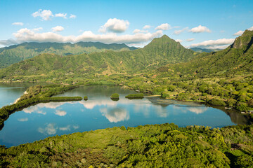 Aerial view of the ancient Moli'i fishponds with reflections of the Koolau mountains in the ponds. The ponds are located near Kaneohe, on the island of Oahu, Hawaii, USA.