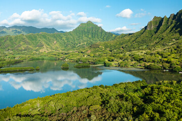 Naklejka na ściany i meble Aerial view of the ancient Moli'i fishponds with reflections of the Koolau mountains in the ponds. The ponds are located near Kaneohe, on the island of Oahu, Hawaii, USA.