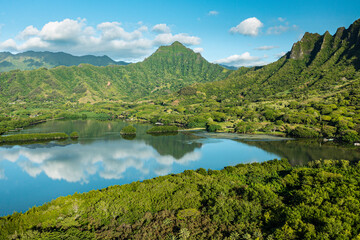 Fototapeta na wymiar Aerial view of the ancient Moli'i fishponds with reflections of the Koolau mountains in the ponds. The ponds are located near Kaneohe, on the island of Oahu, Hawaii, USA.