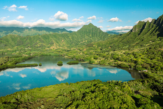 Aerial view of the ancient Moli'i fishponds with reflections of the Koolau mountains in the ponds. The ponds are located near Kaneohe, on the island of Oahu, Hawaii, USA.