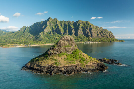Mokoli'i island in Oahu, Hawaii, with the Ko'olau mountain range