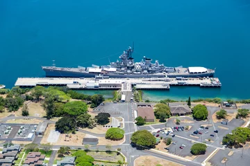 Fototapeten Aerial view of the USS Missouri in Pearl Harbor, Oahu, Hawaii. Ample copy space in blue water. © Patrick