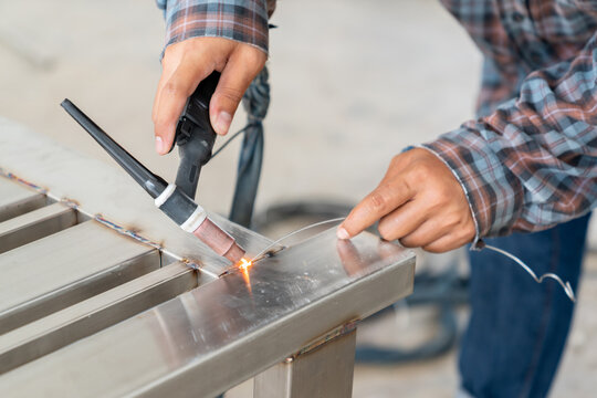 Workers don]t use leather gloves it's not safety, Argon Welding in industrial plants.