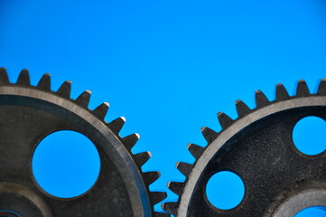 Banner with several metal gears on a blue background.