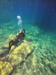 Naklejka na ściany i meble Tourists scuba dive Mediterranian Sea. Marmaris,Turkey.