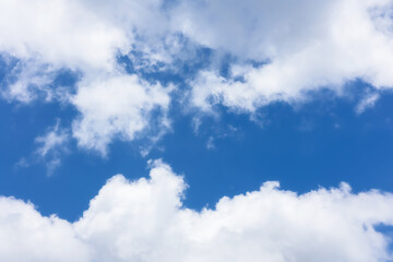 blue sky background with tiny clouds.