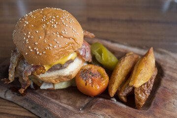 hamburger on wood background, unhealthy food