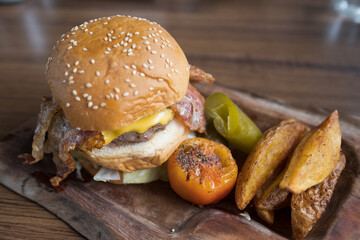 hamburger on wood background, unhealthy food