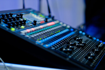 sound check for concert, mixer control, music engineer, backstage 
