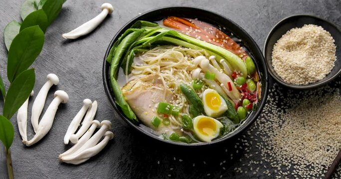 Asian soup ramen on black background.