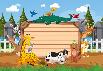 Empty wooden board with various wild animals in the forest