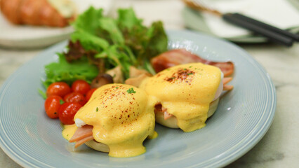Breakfast Eggs Benedict toasted English muffins. Delicious breakfast with eggs Benedict