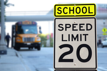Traffic sign.  School zone  yellow warning board. Speed limit 20