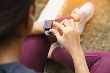 close-up sport women check on her smart watch - Powered by Adobe