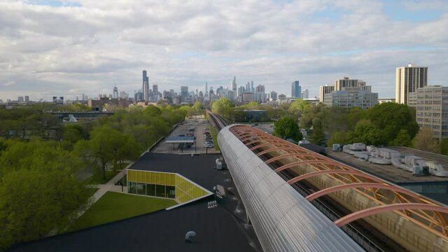 Drone Flying Above Exelon Tube, Chicago Skyline in Background
