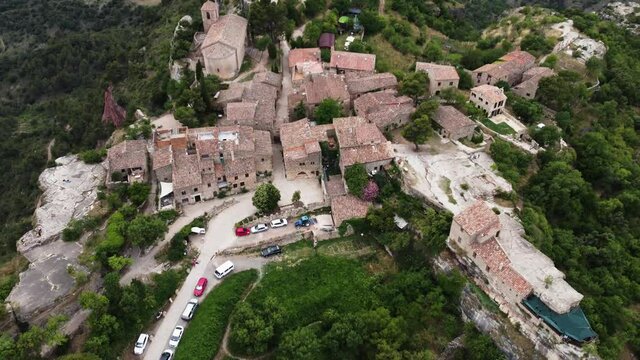 Siurana Village From Above Overlooking Reservoir In The Prades Mountains, Tarragona, Catalonia, Spain. - aerial
