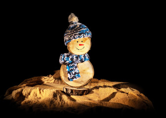Handmade wooden snowman with crochet hat and scarf