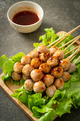 grilled meatballs skewer with spicy sauce