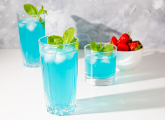mojito cocktails with ice and mint and strawberries